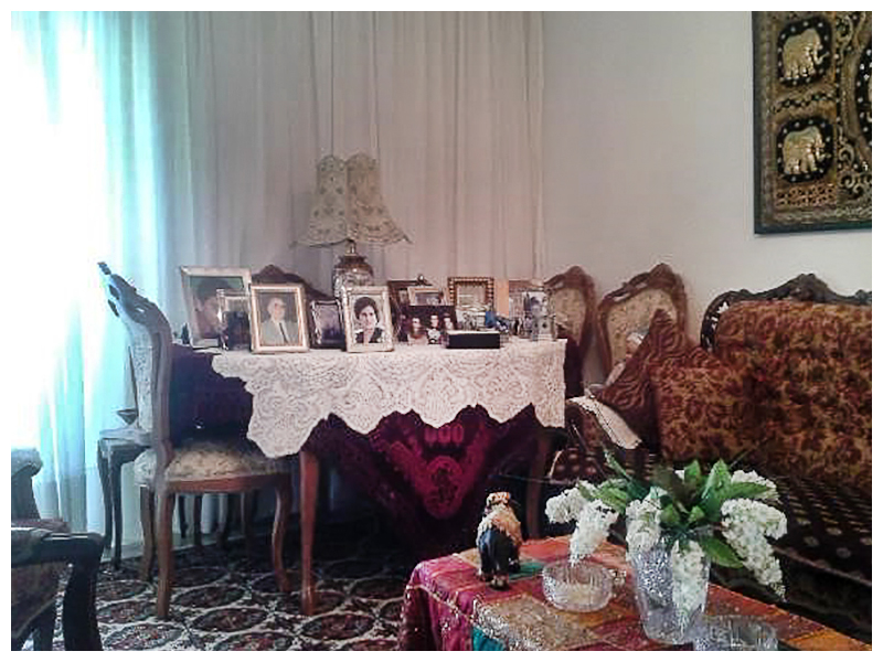 Photograph 3. The dining table in the living room of the Greek middle class household decorated, almost always, with family photographs