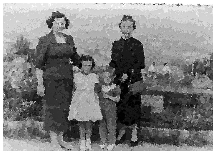 Photograph 5: This picture shows Amalia with her brother, standing between her mother and her grandmother.